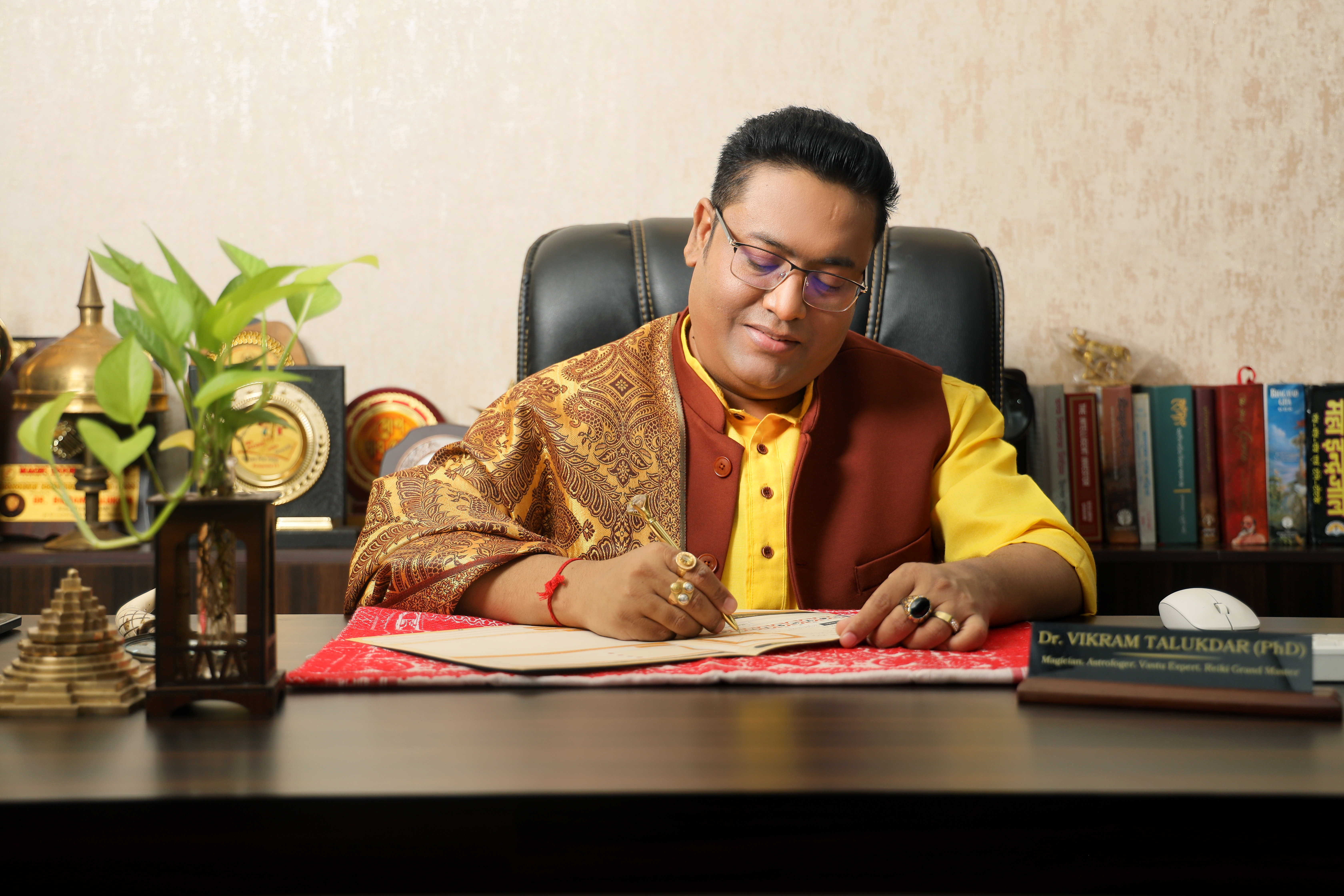Dr. Vikram Talukdar working at his consultation desk